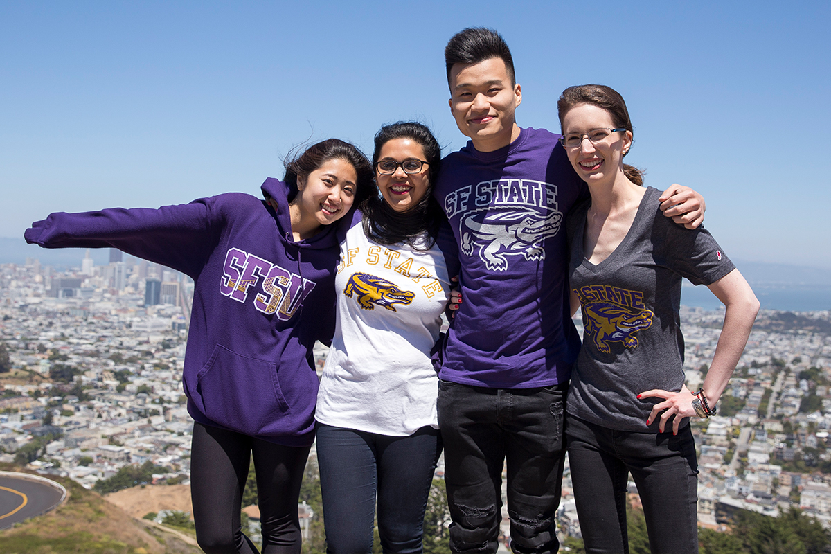 students wearing different SF State merchandise like t-shirts, and sweaters in different colors